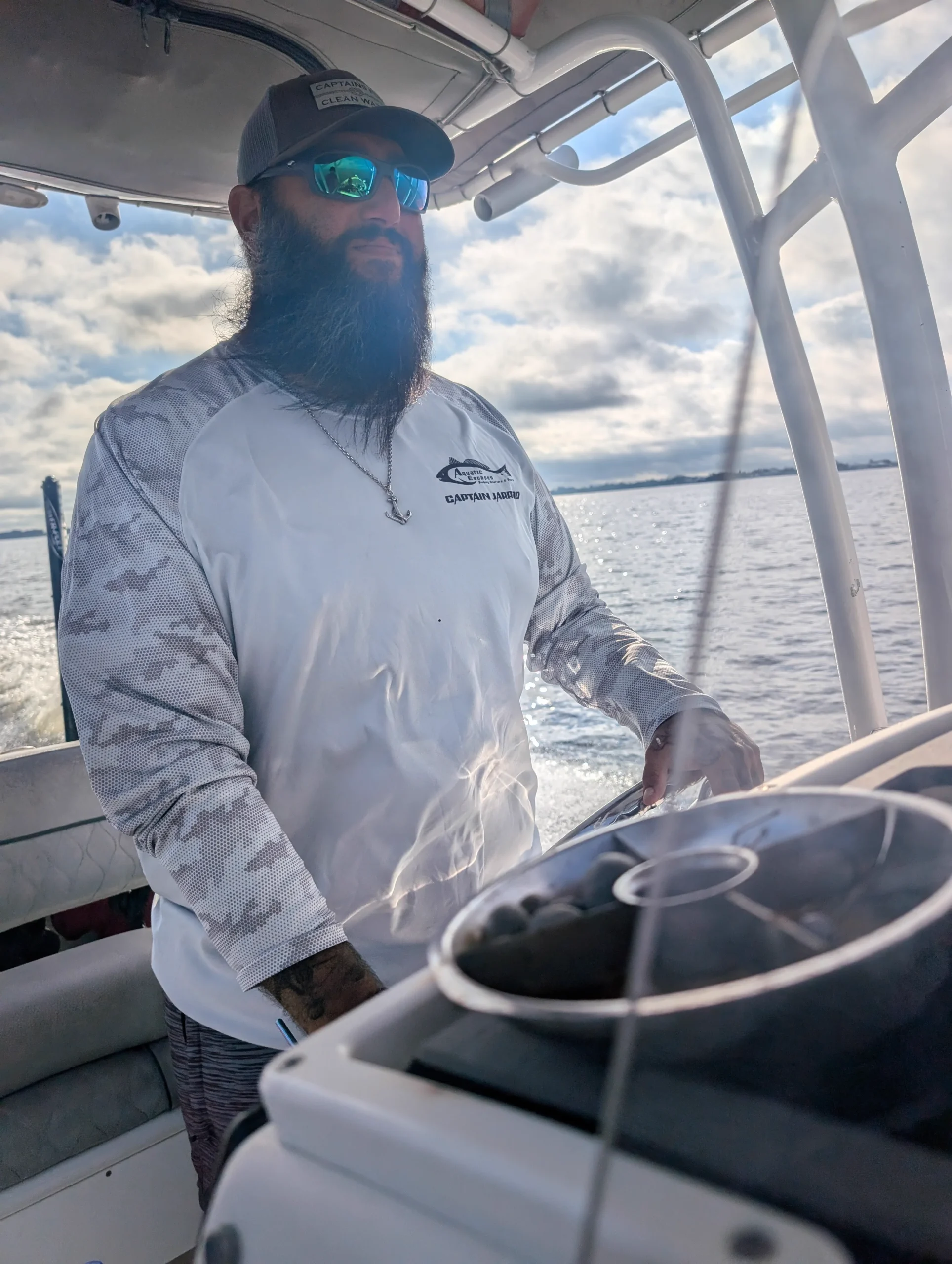 Captain Jarrod Wallach at the helm of his charter boat