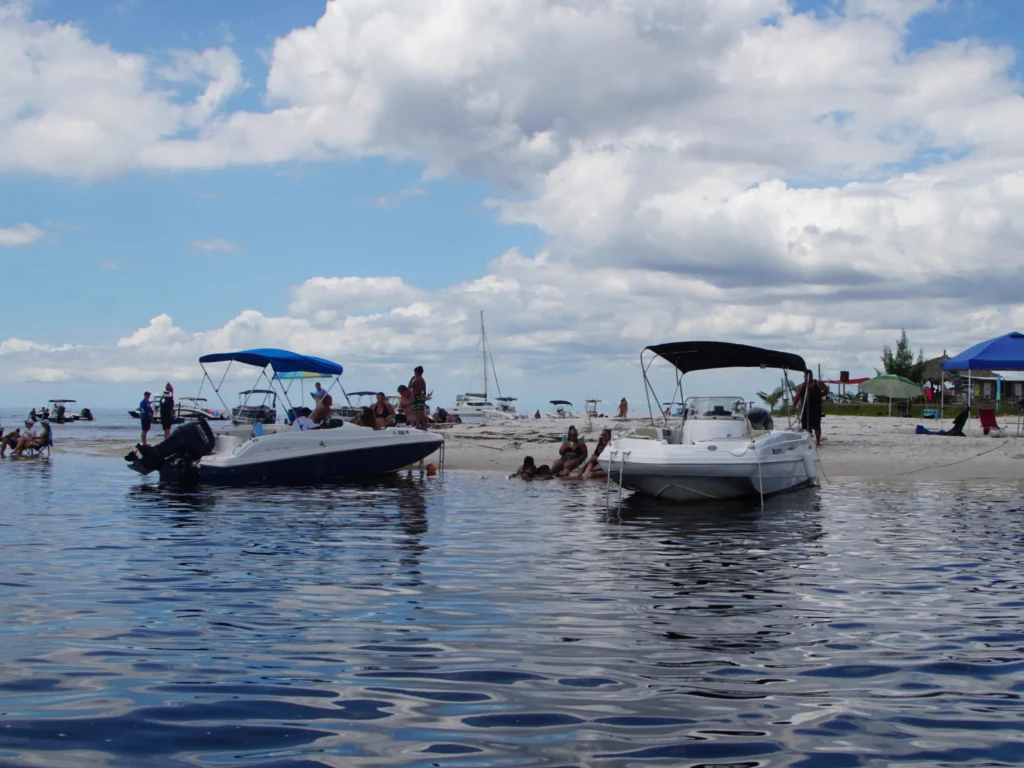 Boats anchored at a sandbar on a Tampa Bay island hopping trip