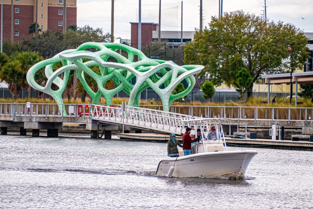 A group aboard the center console on the Hillsborough River by the Tampa Riverwalk