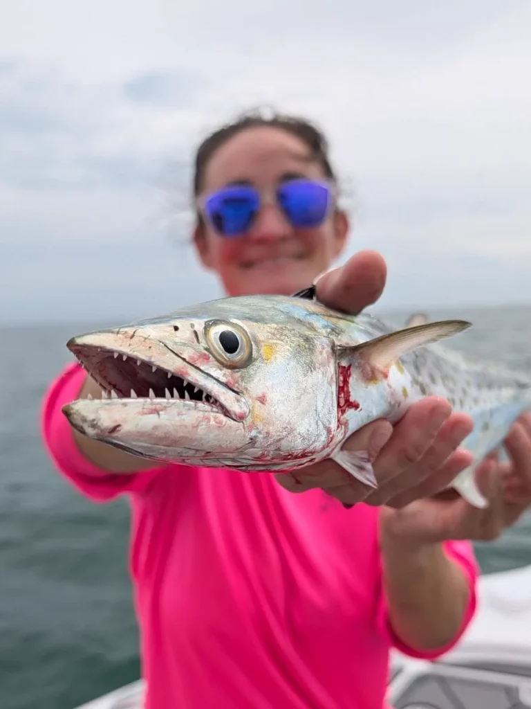Jennifer holding a Spanish mackerel caught on a Tampa Bay fishing charter