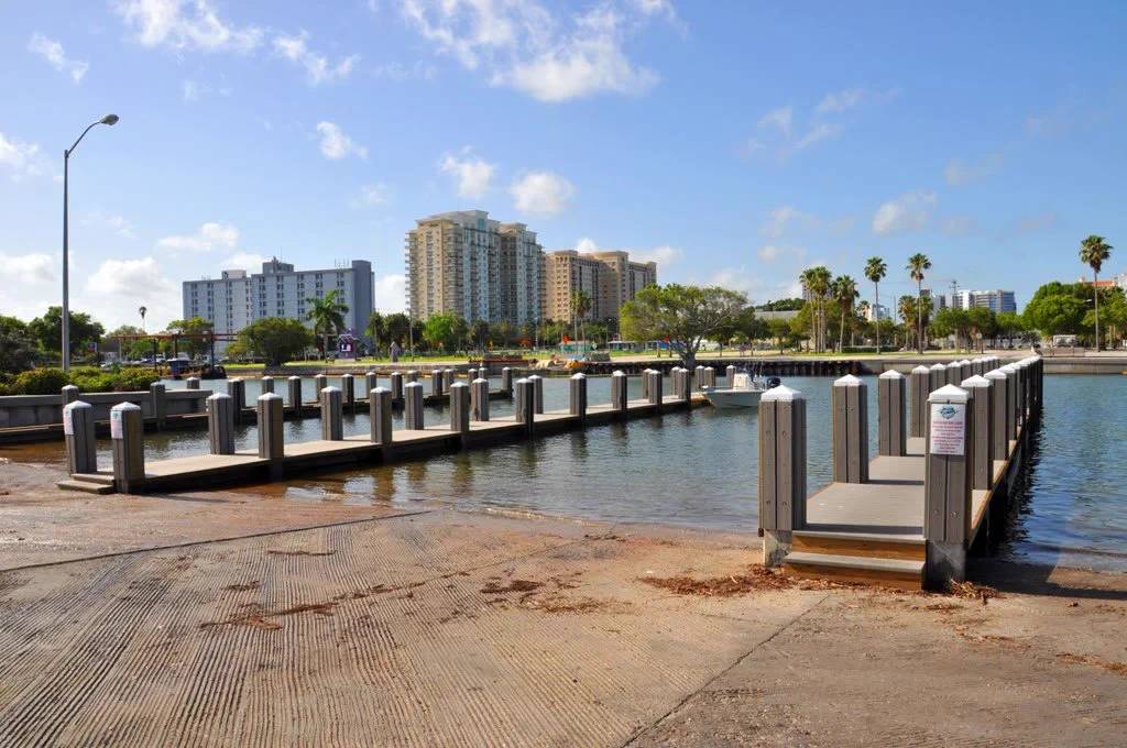 Centennial Park boat ramps and floating docks on Sarasota Bay with the downtown Sarasota skyline